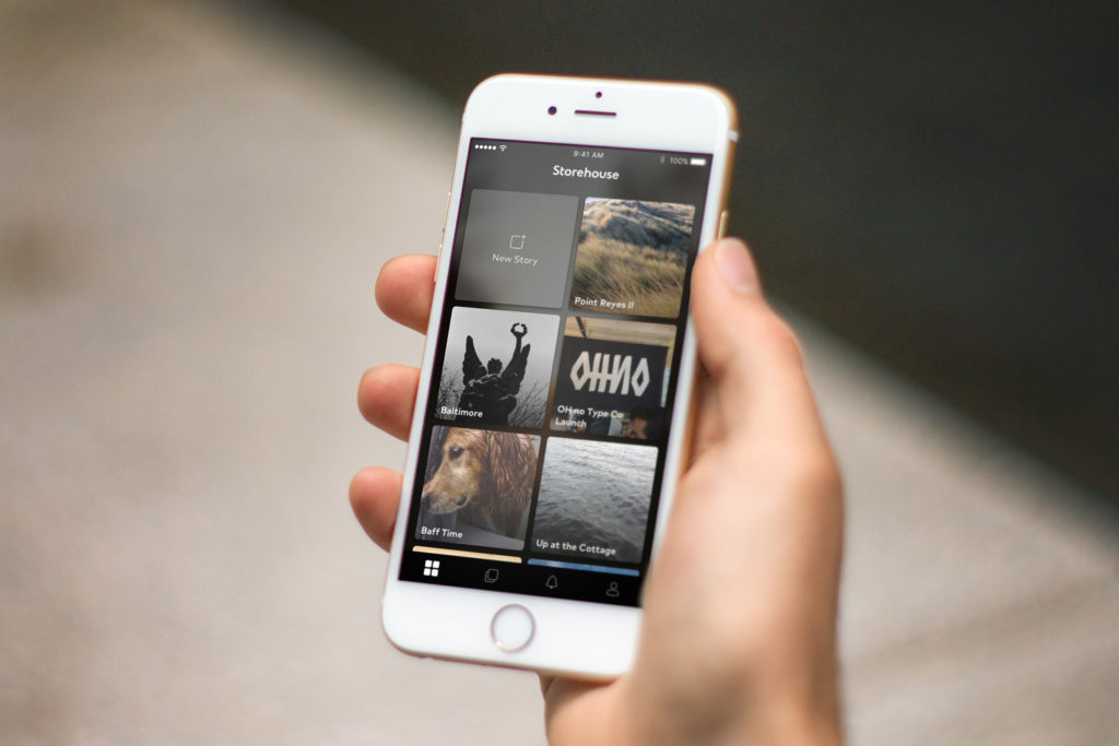 Home view of Storehouse on an iPhone held in a hand.